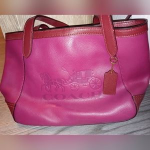 Plum/pinkish Coach purse.